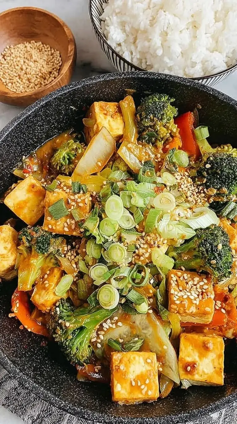Colorful Tofu Vegetable Stir-Fry with broccoli and peppers in a creamy peanut sauce